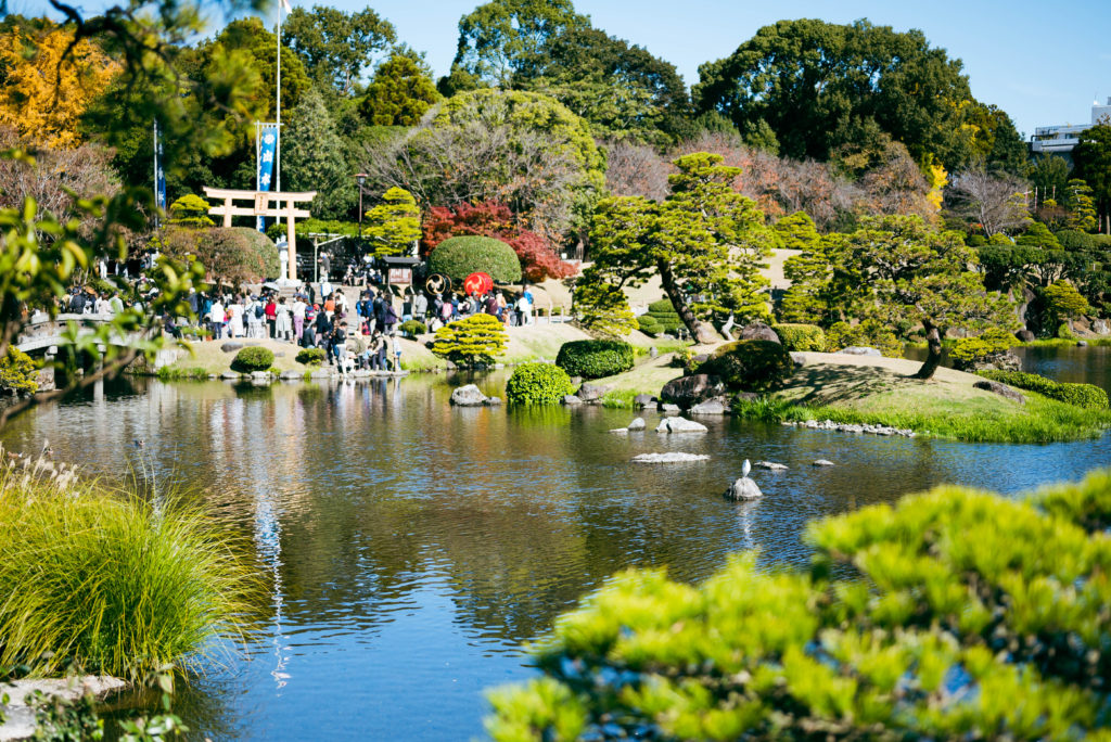 View of Izumi Shrine over pond at Suizenji